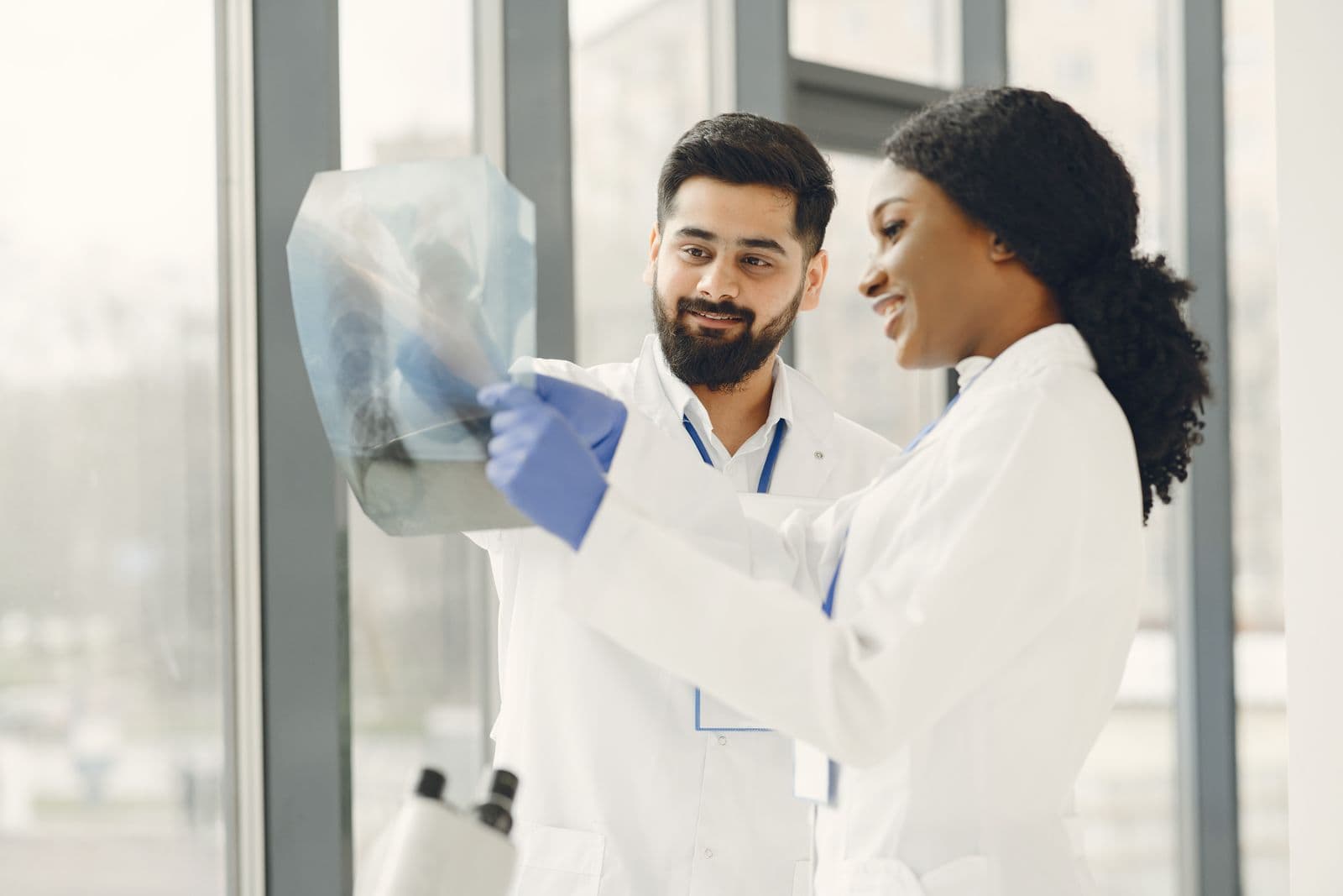 Two doctors reviewing an X-ray together at a diagnostics site
